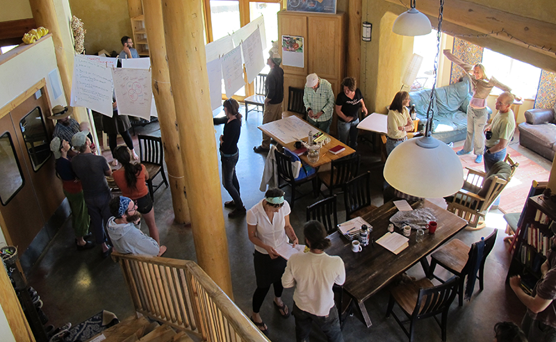 People standing in a big open space during an exercise of community mapping in southern oregon